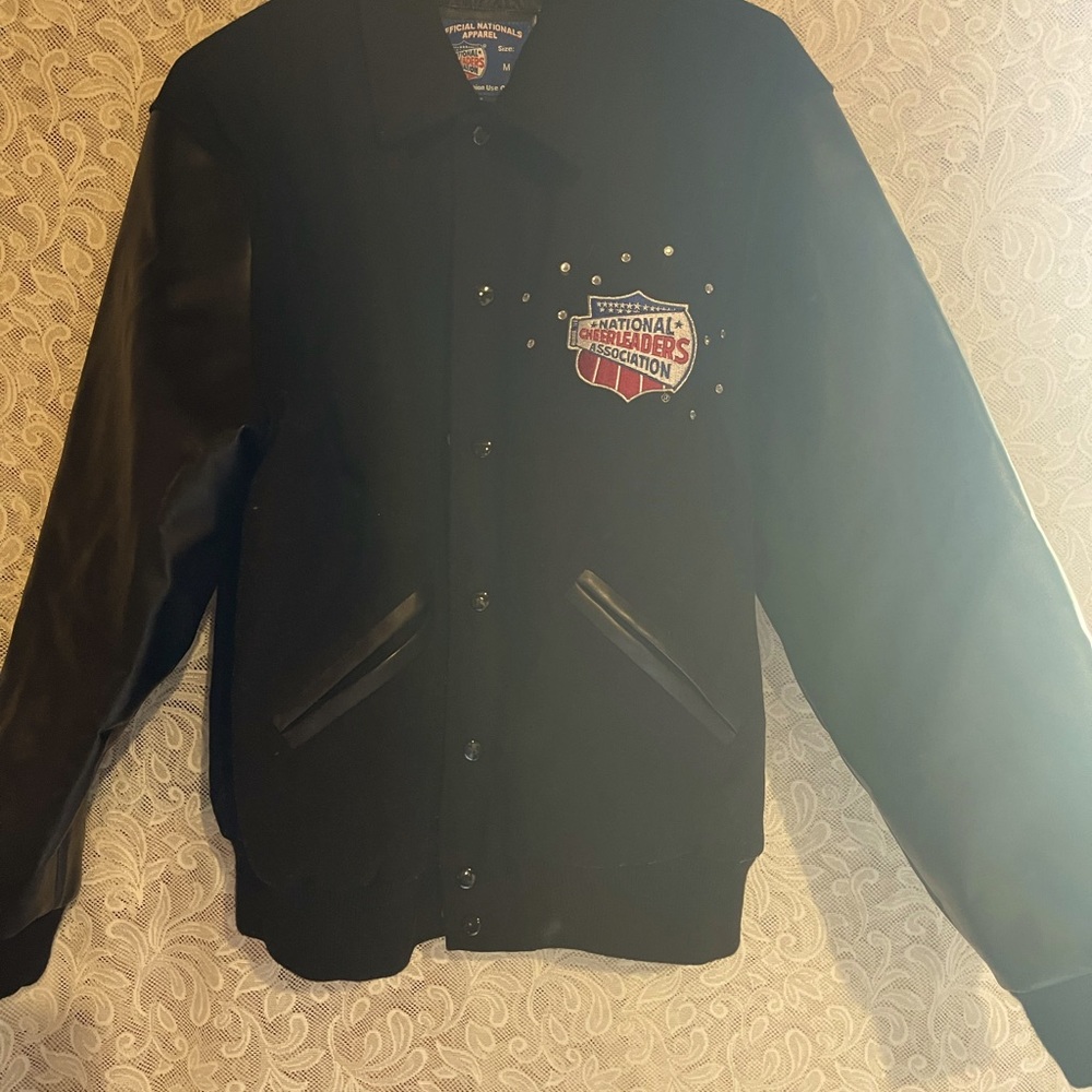 NCA NATIONAL CHEERLEADERS ASSOCIATION NATIONAL CHAMPION  JACKET SIZE-Medium.